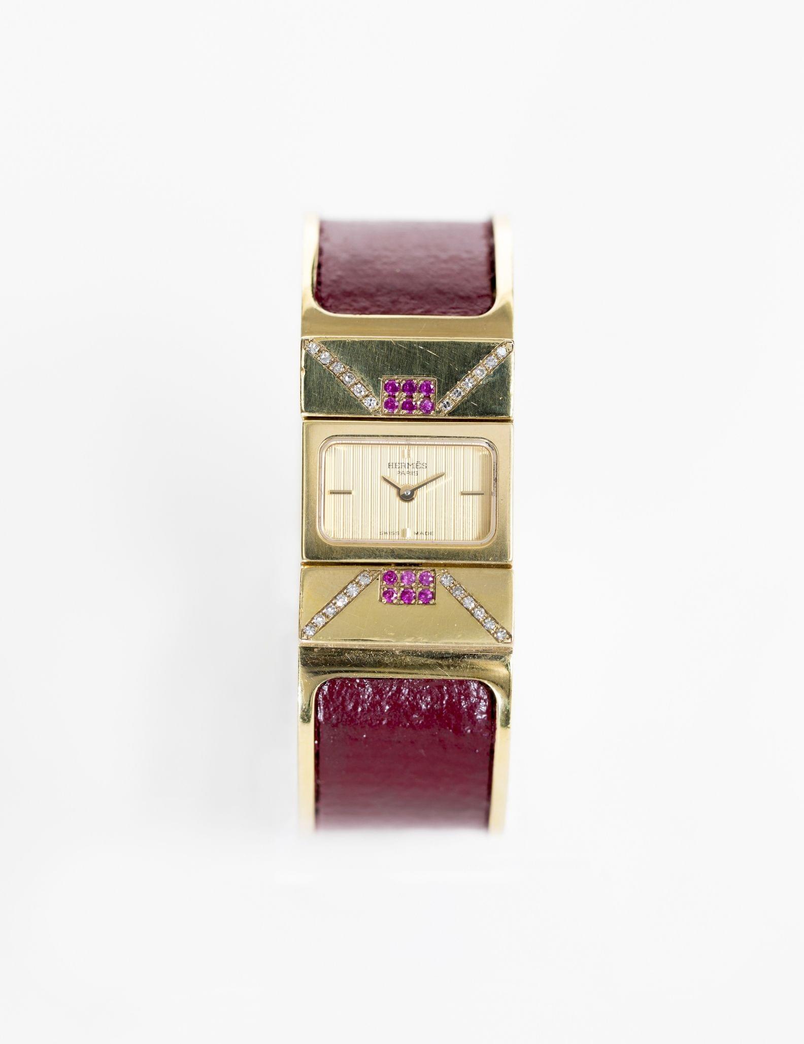 Hermès, loquet, montre-bracelet à quartz sertie de diamants et rubis d'imitation